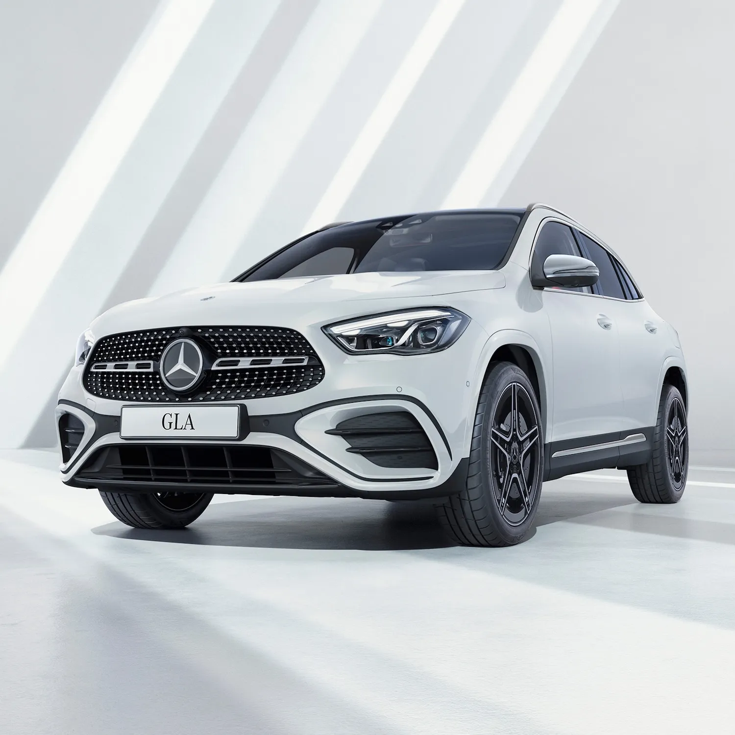 Sleek White Mercedes GLA on White Backdrop Wallpaper