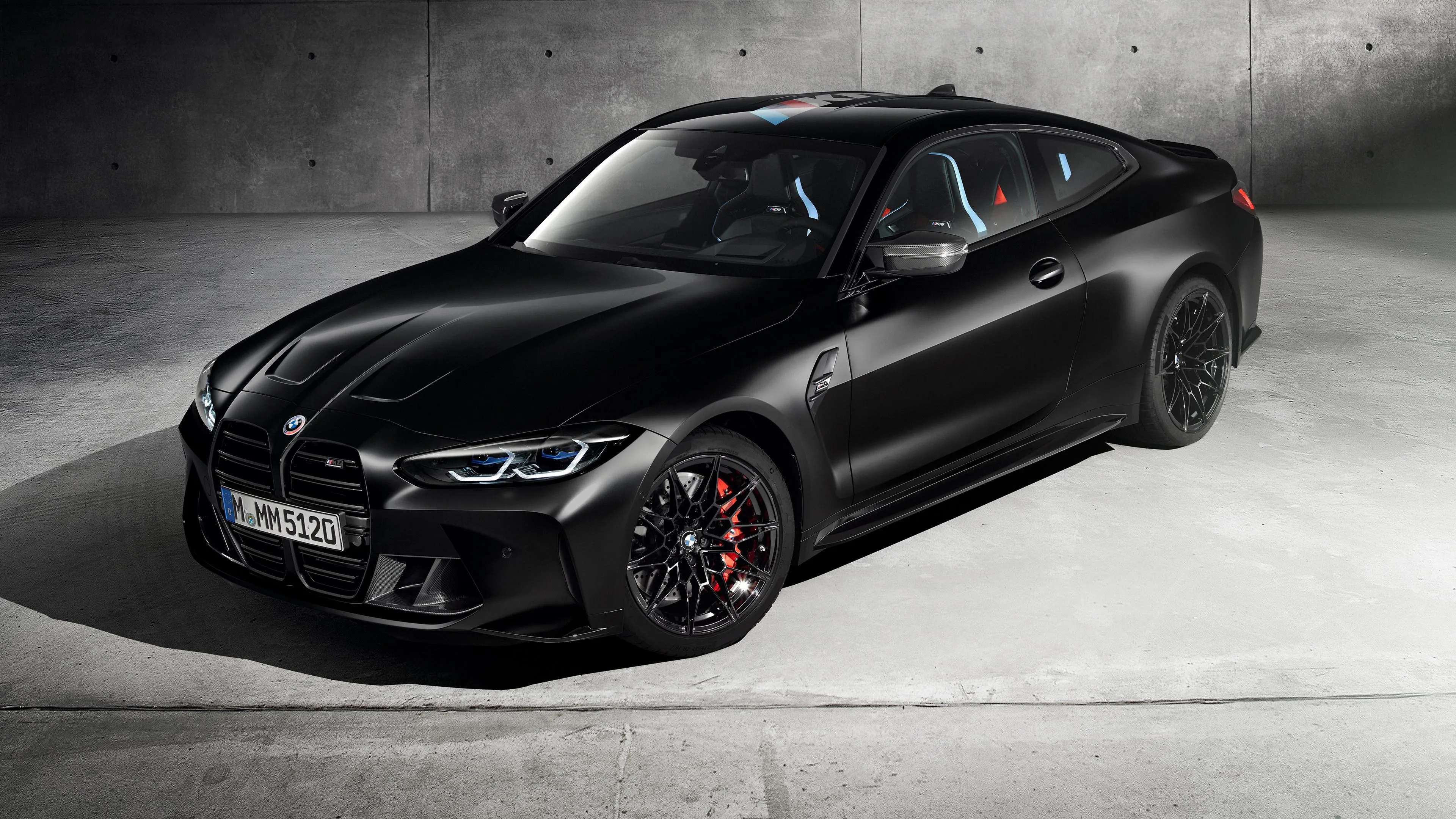 Sporty Black Bmw on White Floor with Aggressive Styling