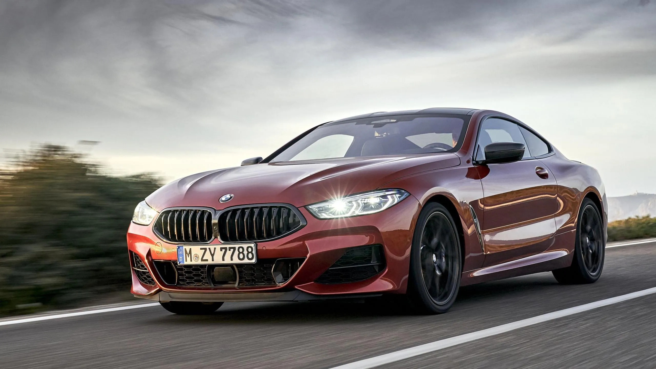 Sporty Bmw Coupe in Motion on Winding Mountain Road