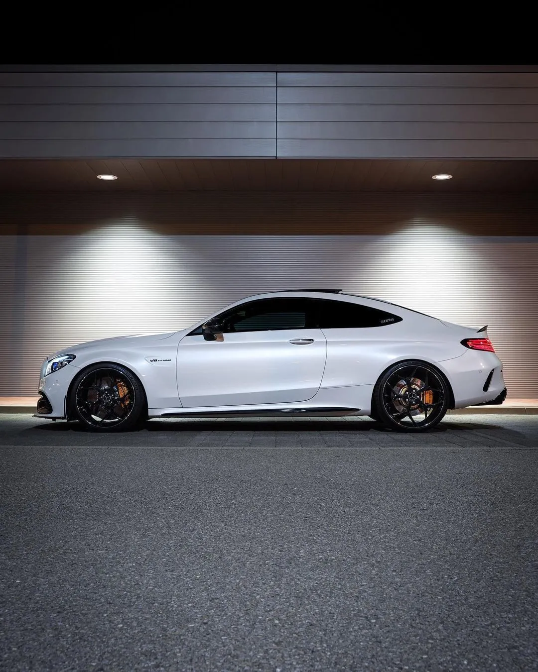 Sporty Mercedes Benz Coupe Parked Under Bright Lights