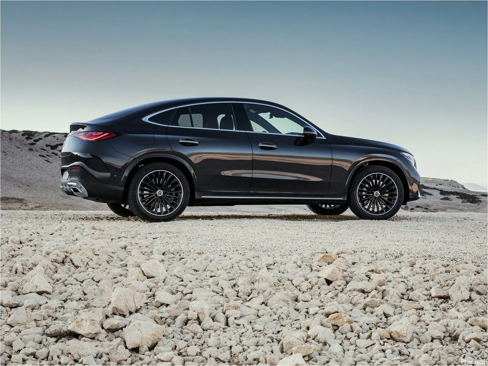 Sporty Mercedes Coupe in Scenic Rocky Environment HD image