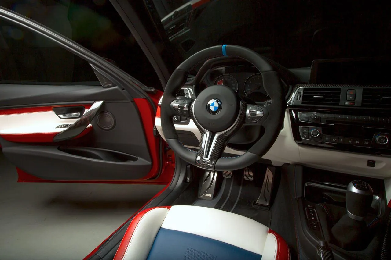 Steering Wheel View of a Vintage Bmw Racing Car Wallpaper