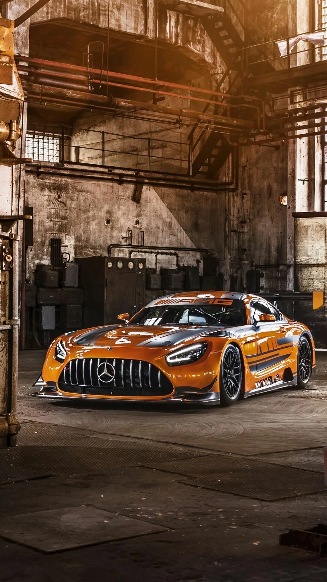 Striking Mercedes Orange Sports Car In An Urban Warehouse