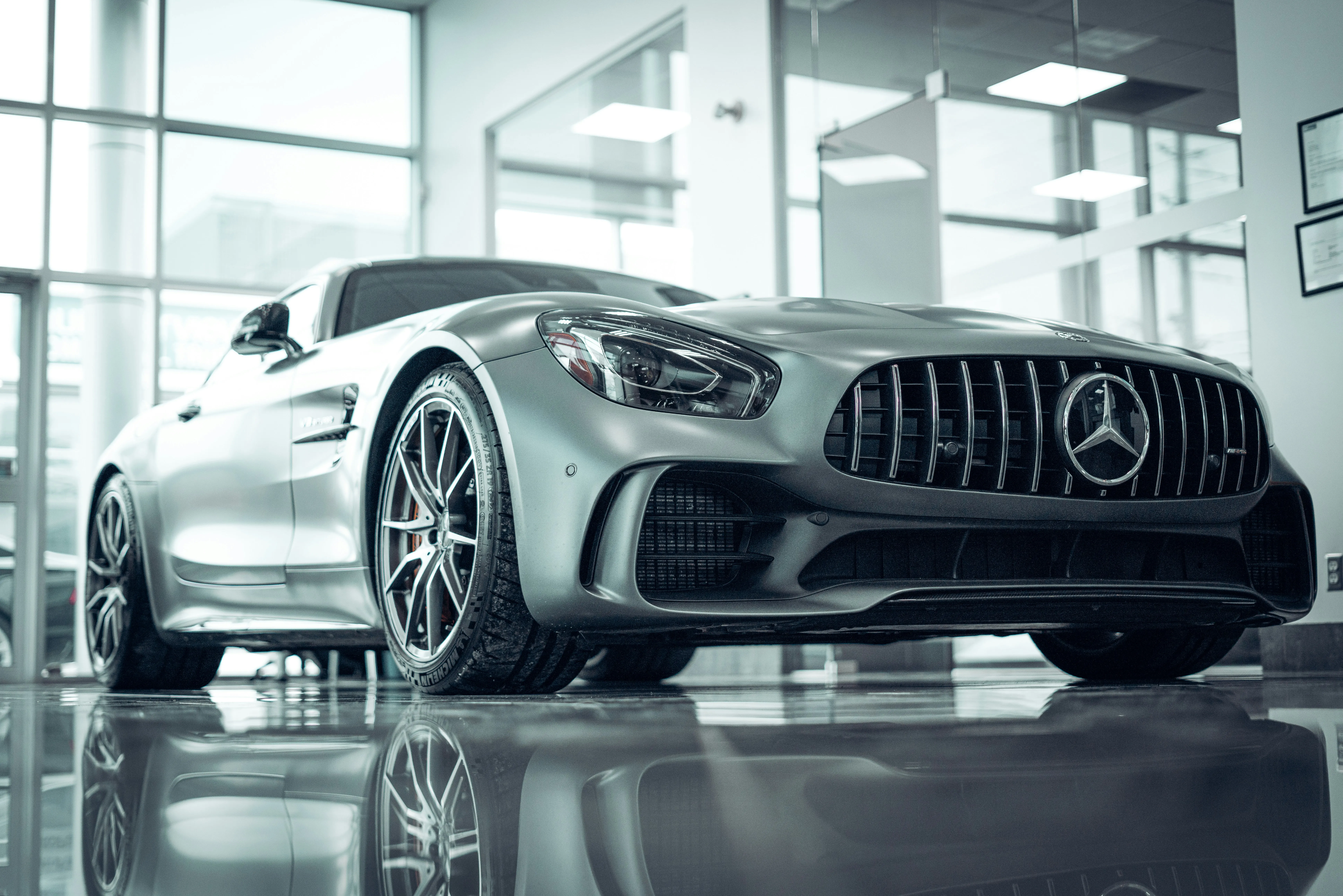 Striking Silver Mercedes AMG Displayed in Showroom Light 4K