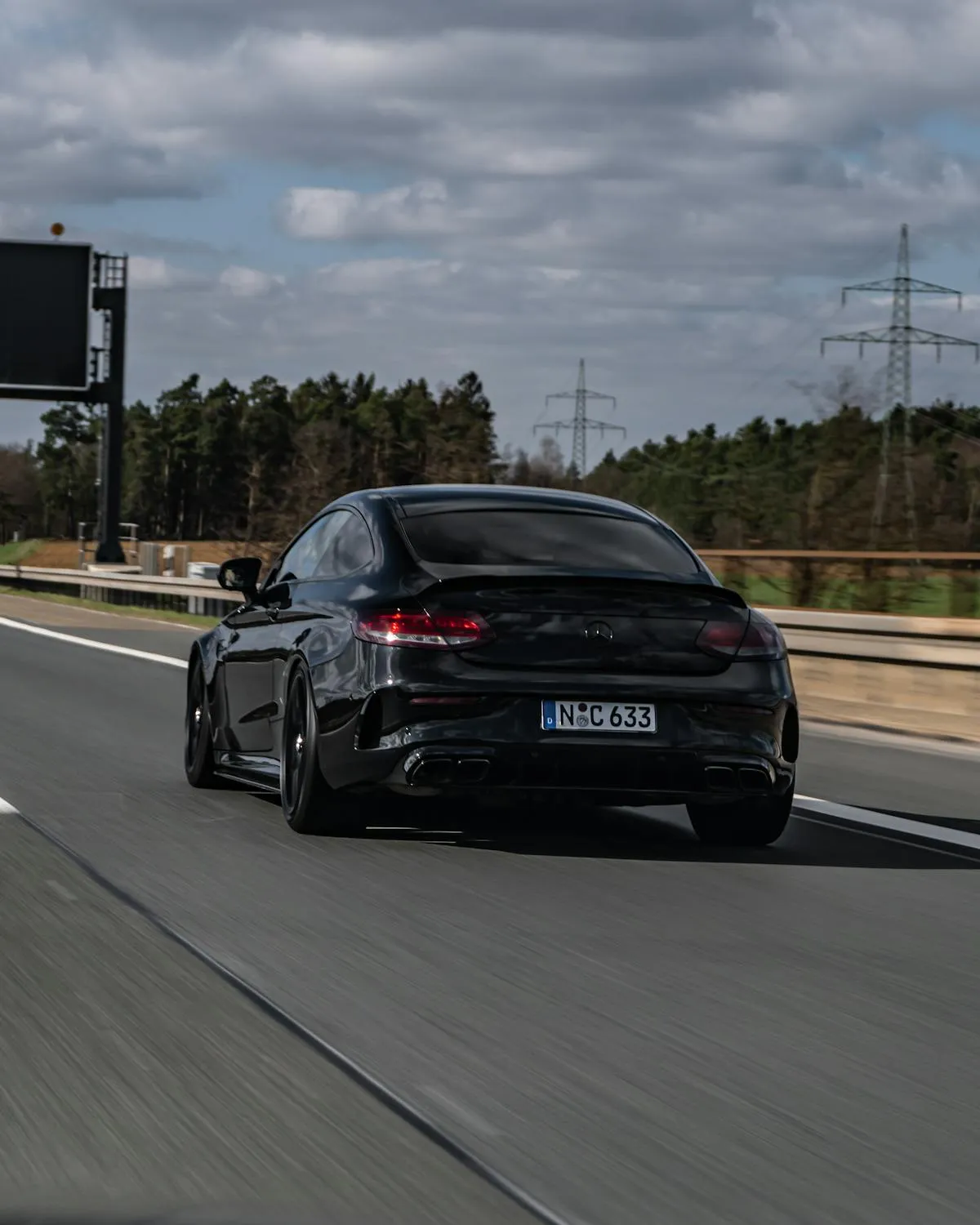 Stunning Black Mercedes Sports Car on Open Highway 4K