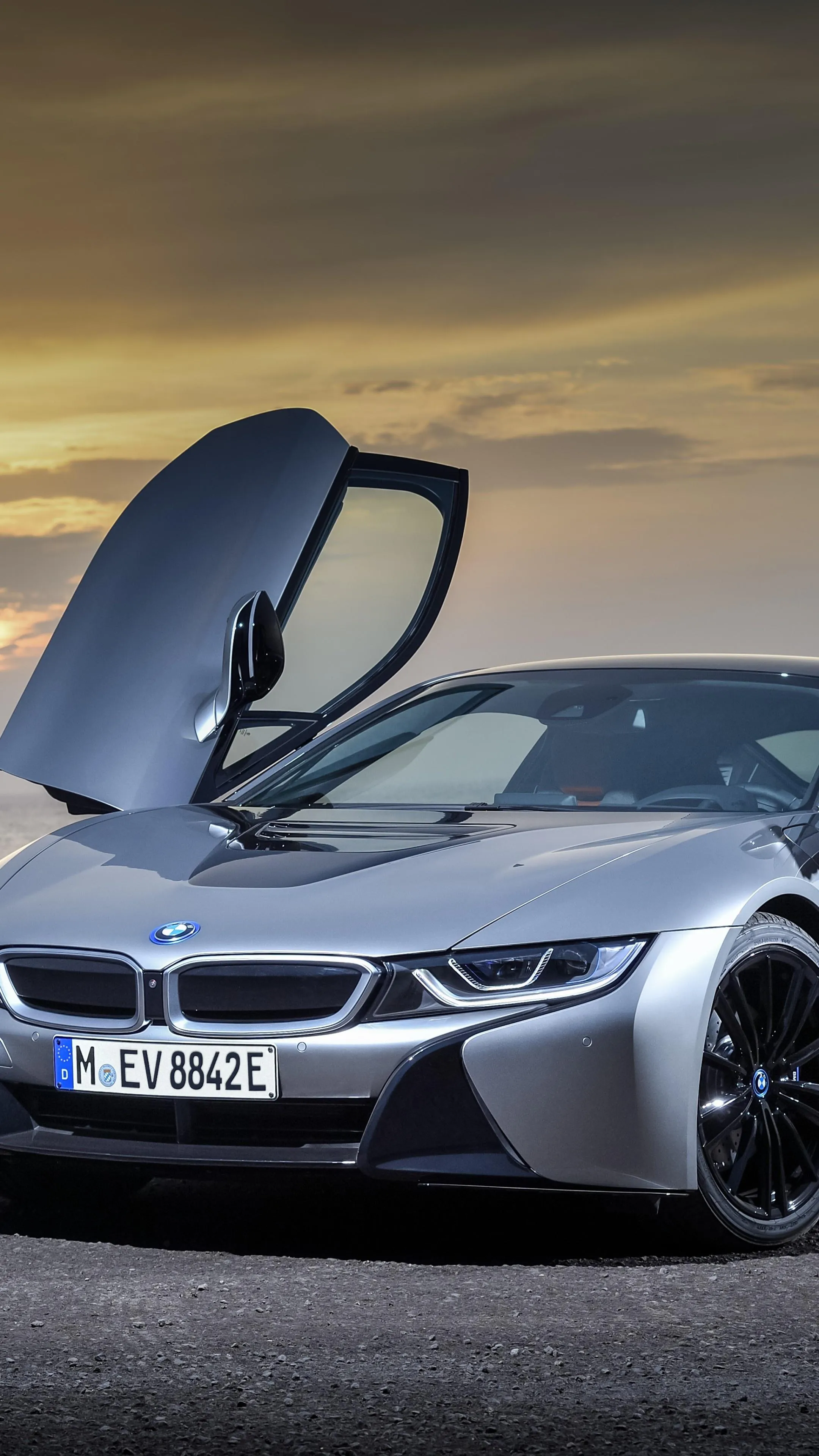 Stunning Bmw I8 with Doors Open During Sunset Wallpaper