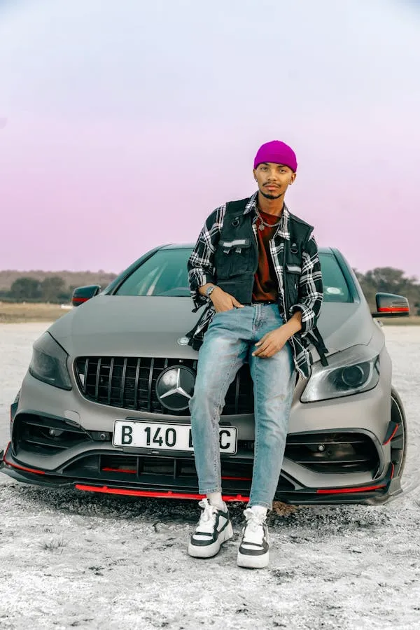 Stylish Man Posing with Mercedes Benz on Open Road
