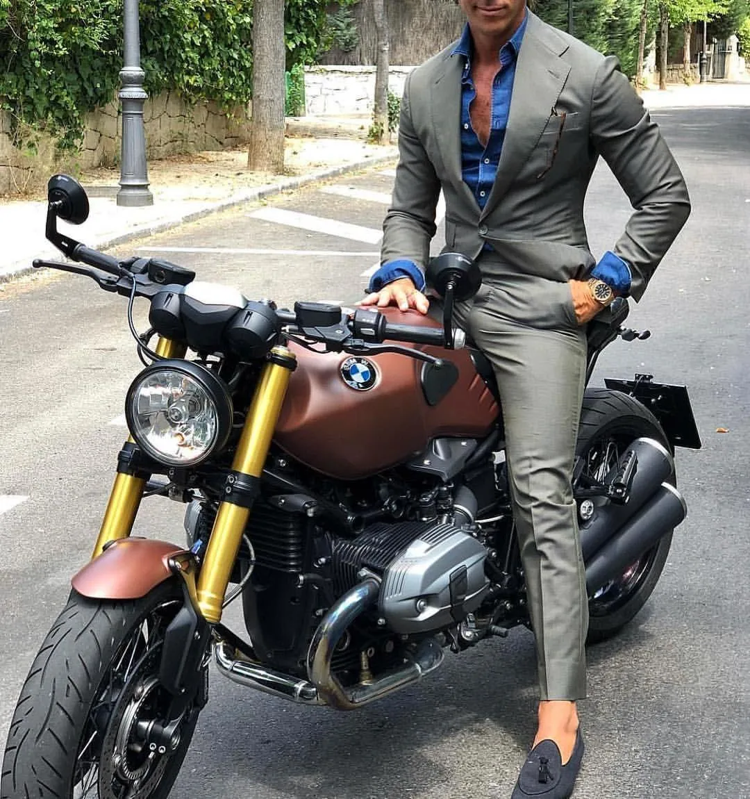 Stylish Person in a Suit Riding a Bmw Motorcycle on Road