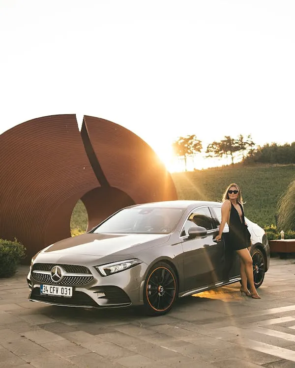Stylish Woman Posing with Mercedes Benz Coupe Wallpaper