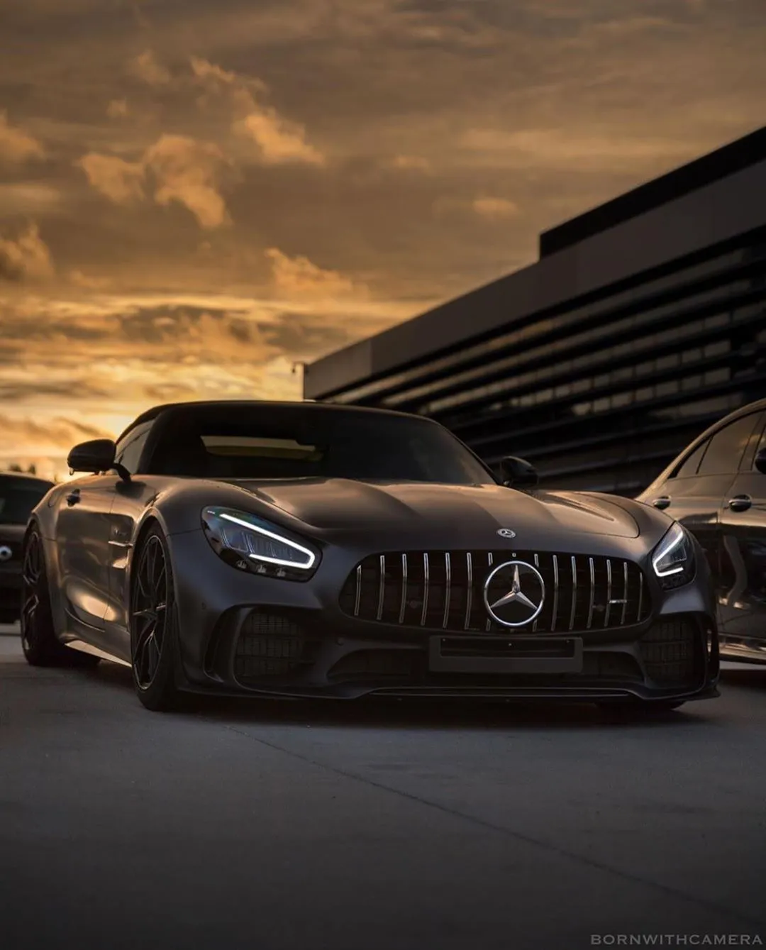 Sunset Over Mercedes Benz AMG in Modern Urban Setting image