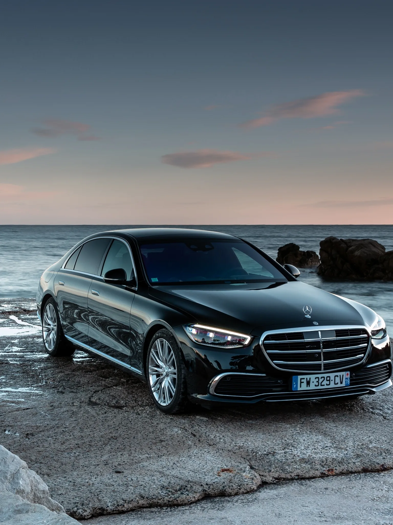 Sunset Reflected on Mercedes Sedan by the Shore Wallpaper