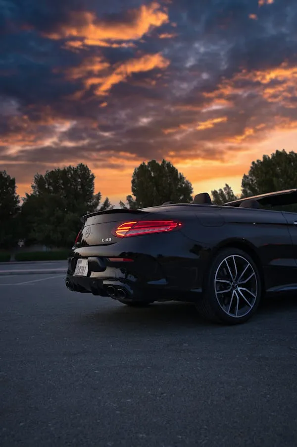 Sunset View Behind a Black Mercedes Benz Coupe Wallpaper