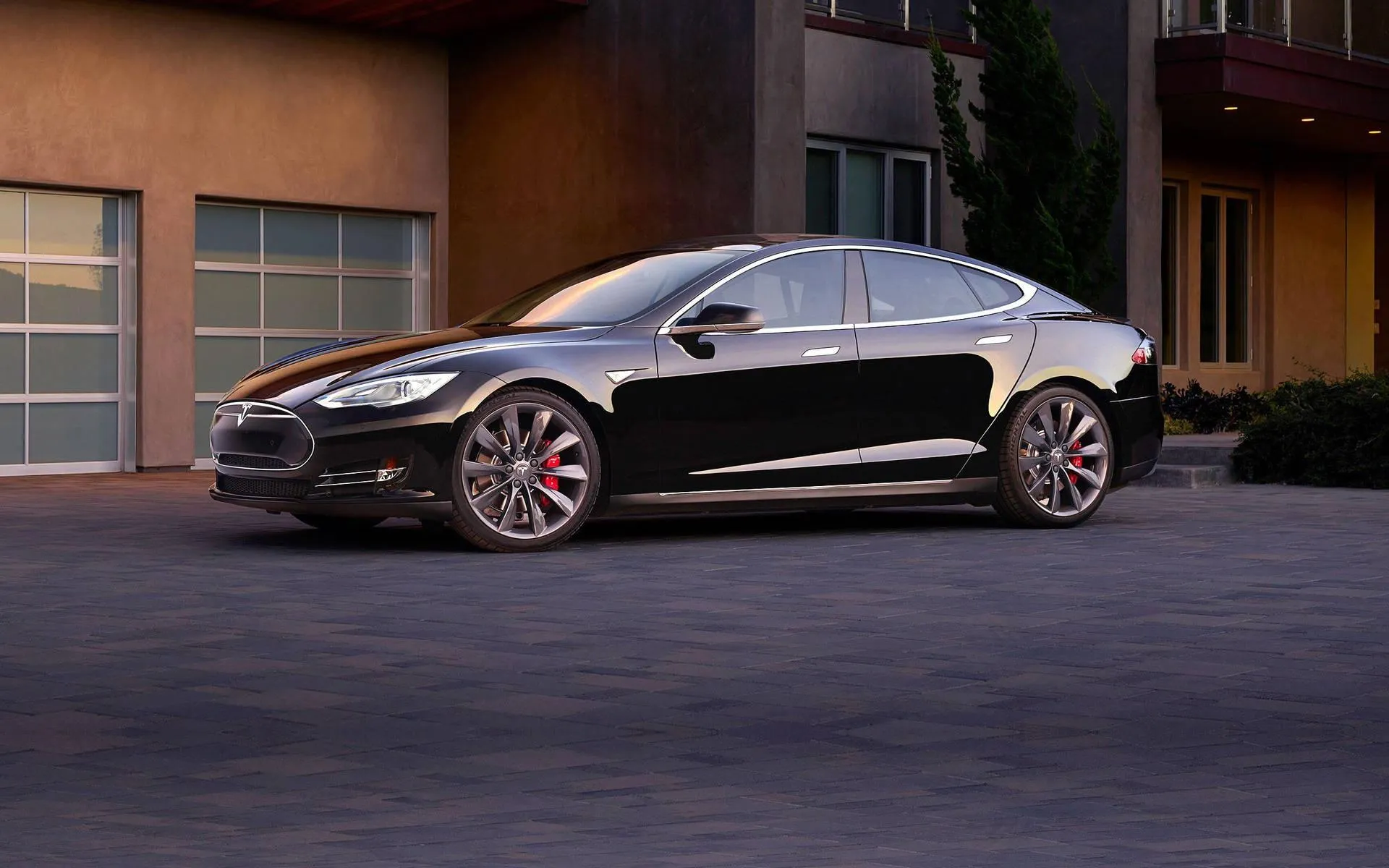 Tesla Model S Black Luxury Side View Parked in Driveway