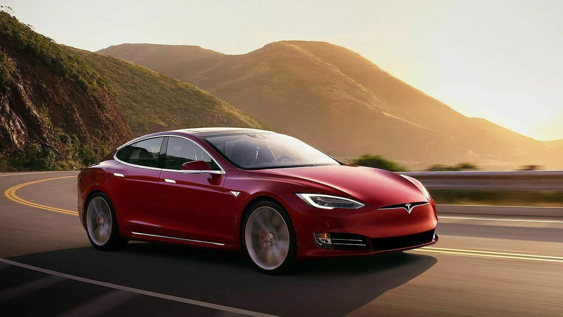 Tesla Model S Red Electric Sedan on Mountain Road HD Image