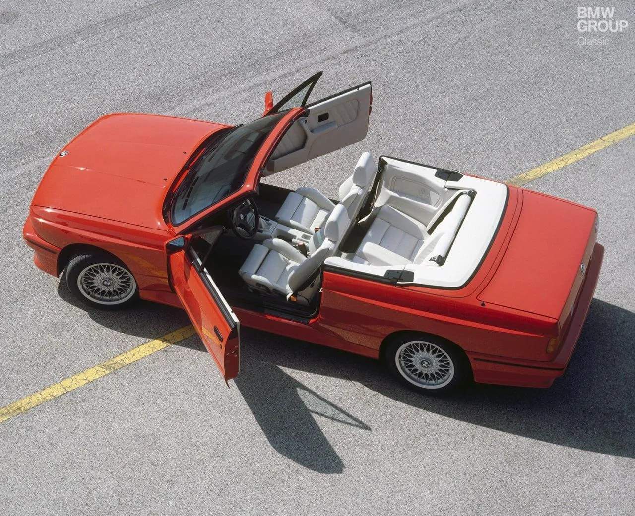 Top Down Red Bmw Convertible with Open Doors Parked