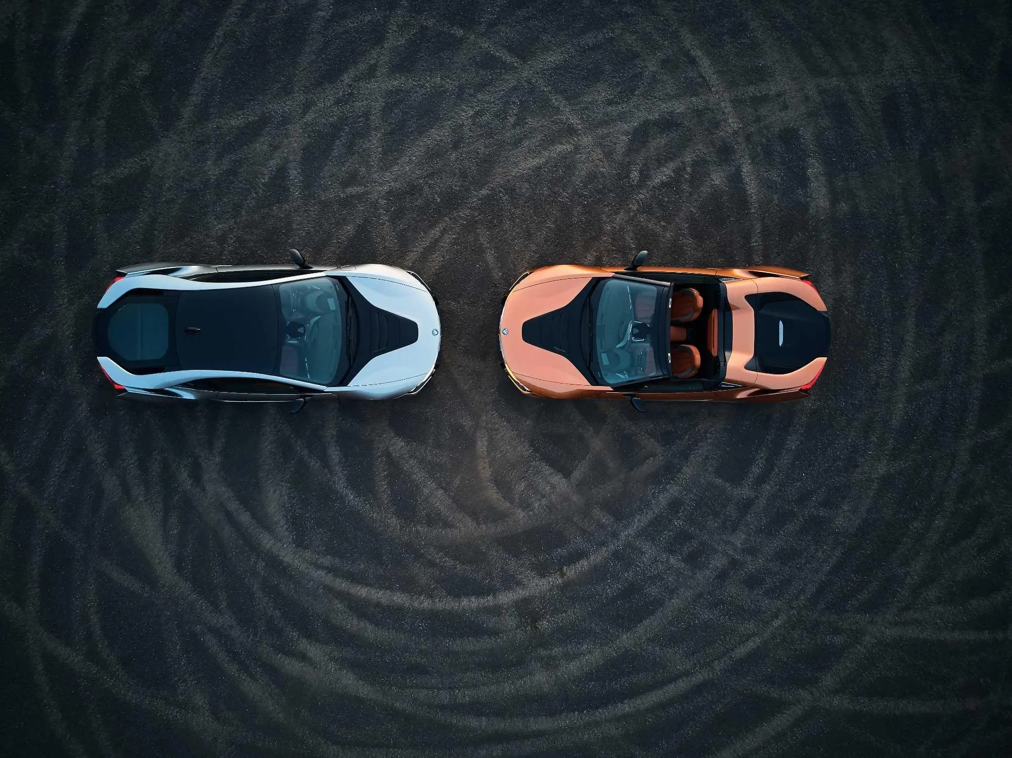 Top View of Two Bmw Sports Cars on a Circular Race Track