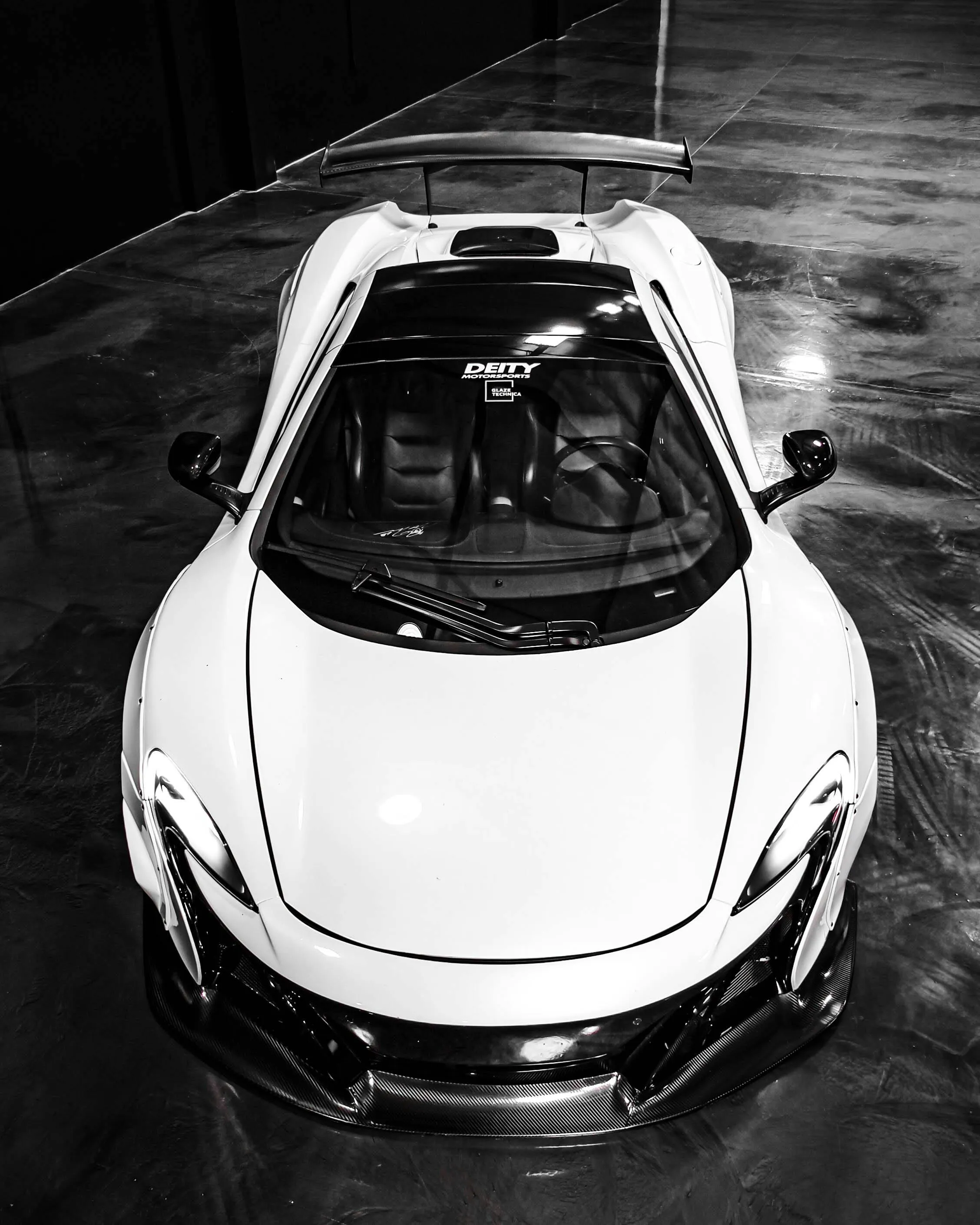 Top View of White Bmw Supercar in Dark Studio Lighting