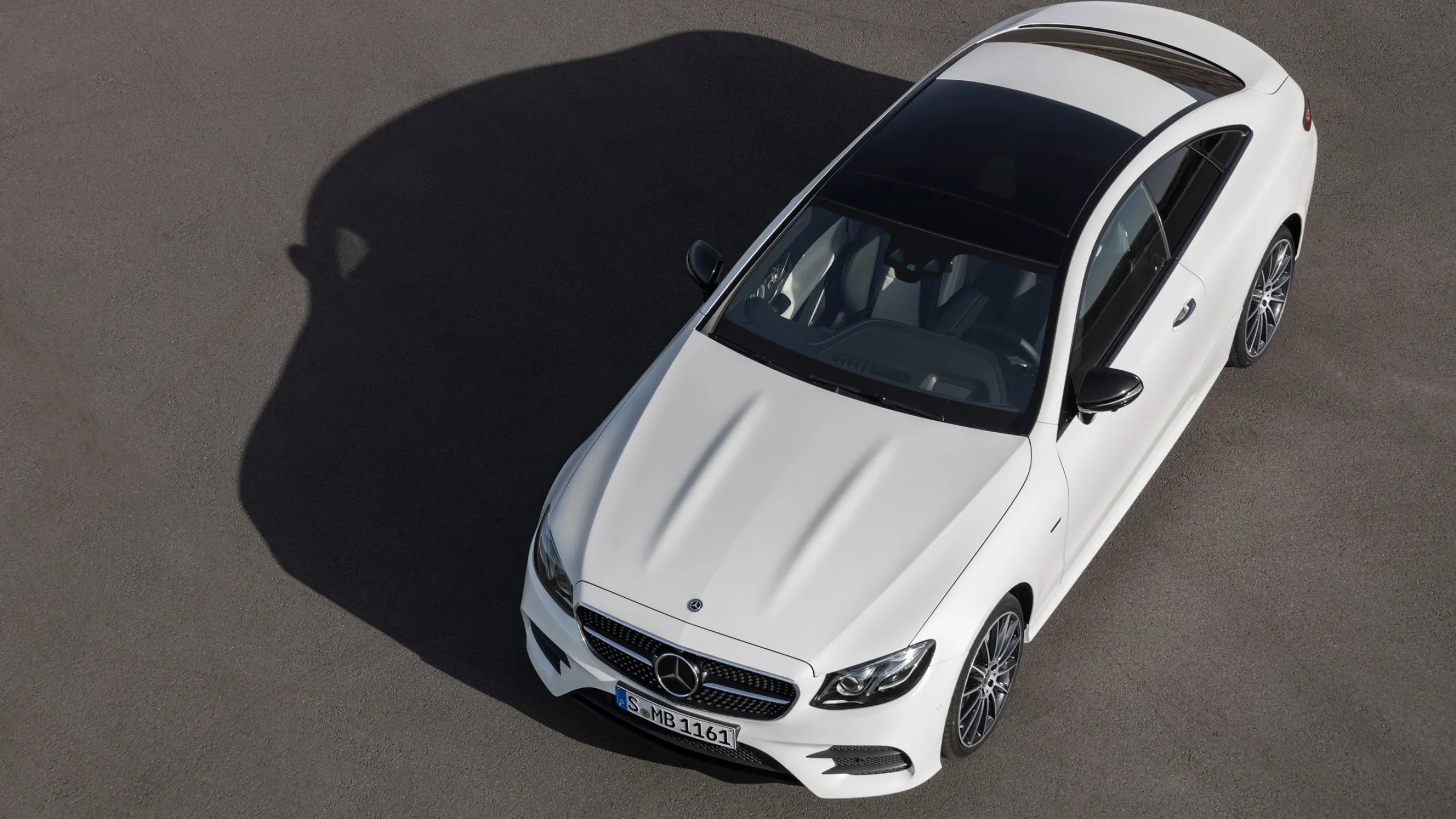 Top View of White Mercedes Benz Car on Asphalt Wallpaper