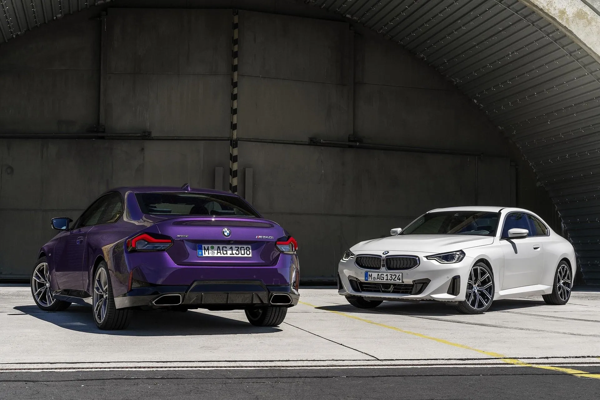 Two Bmw Cars Parked in Tunnel with Stylish Urban Lighting