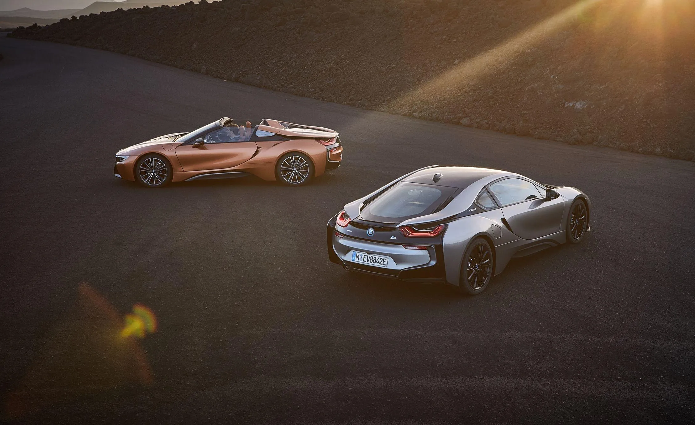 Two Bmw Sports Cars Parked Together in Golden Hour Light