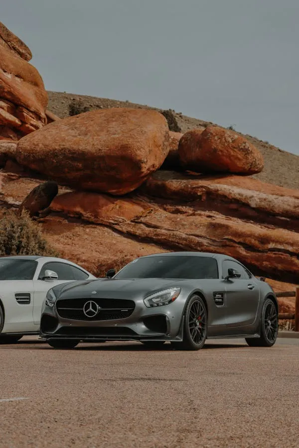 Two Mercedes Benz Sports Cars Parked Near Rocky Landscape