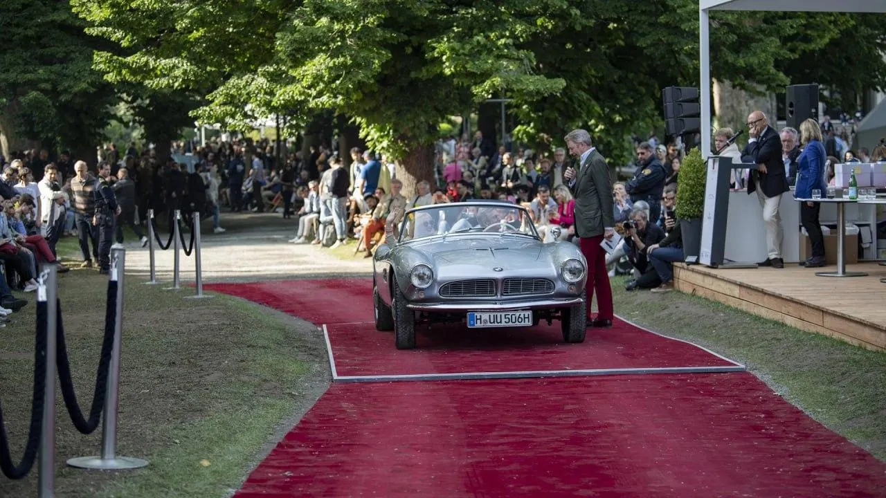 Vintage Bmw Car Displayed on Red Carpet Event Venue