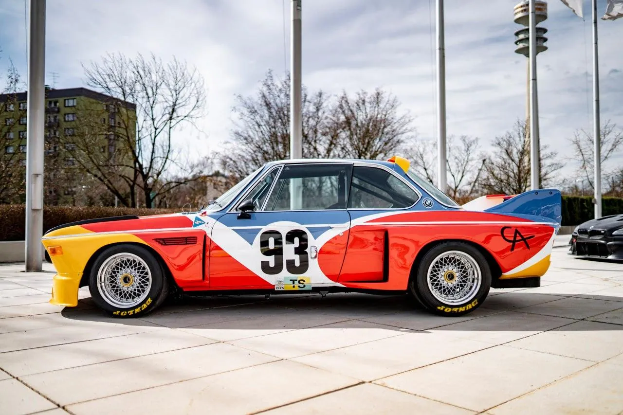 Vintage Bmw Race Car with Number Parked Outdoors