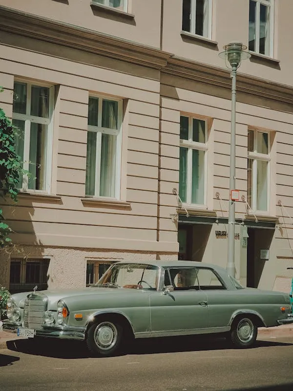 Vintage Mercedes Benz in Front of Elegant Building
