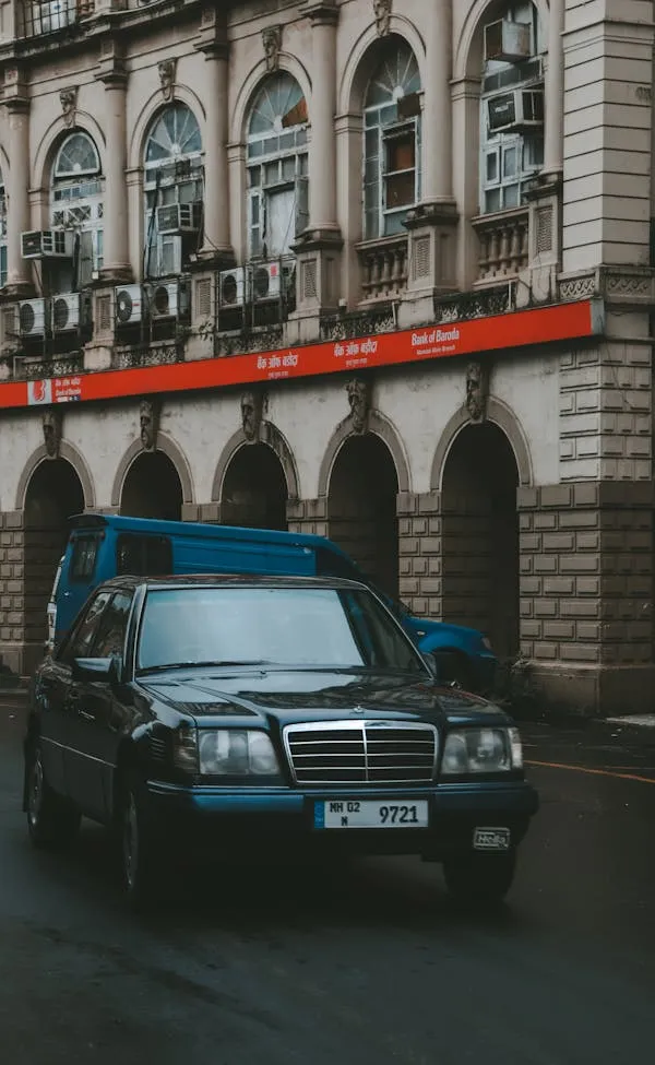 Vintage Mercedes Benz Parked on Street near Bank image