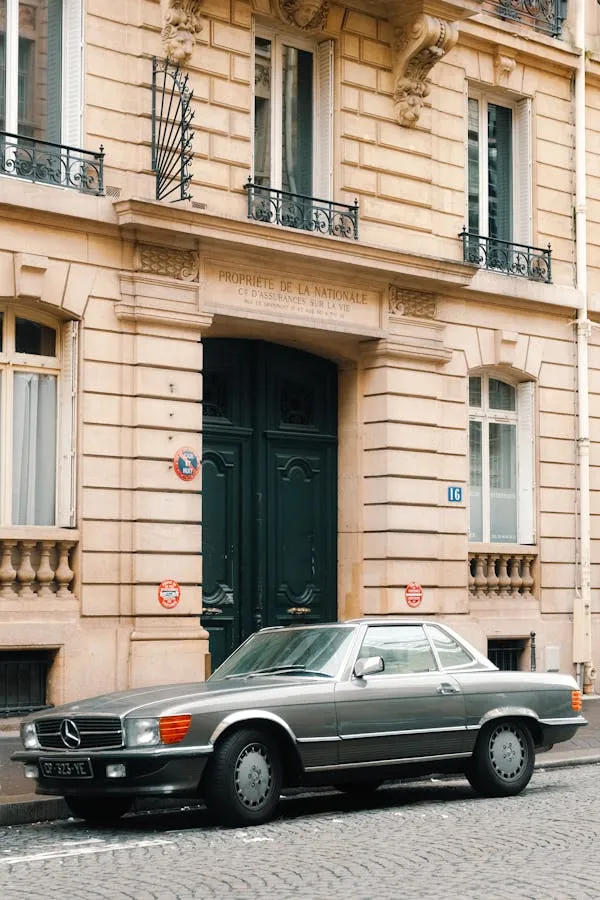 Vintage Mercedes Parked by Elegant European Building