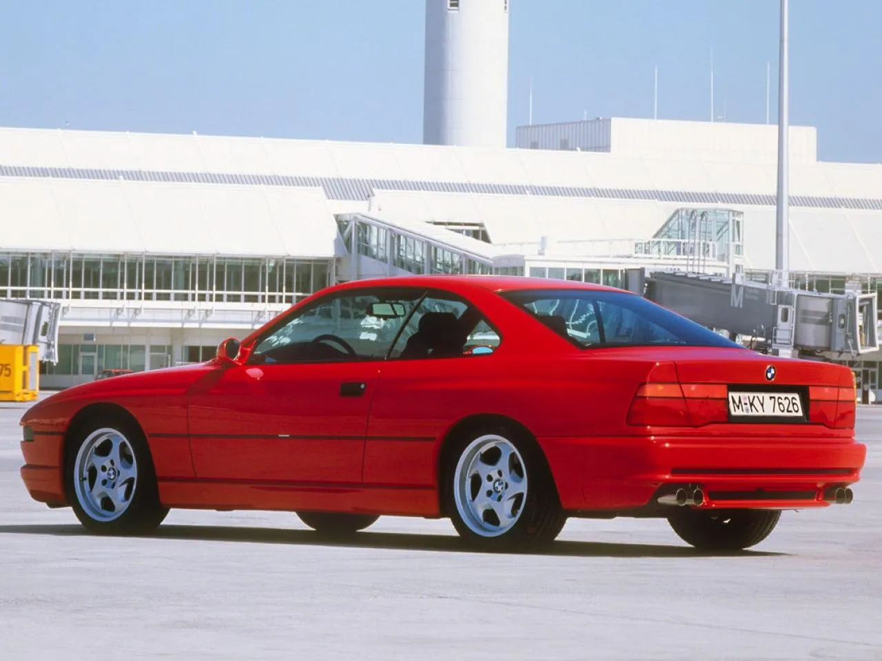 Vintage Red Bmw Parked Outside White Factory Building