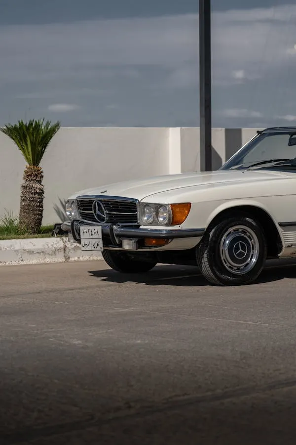 Vintage White Mercedes Coupe Parked by the Roadside image