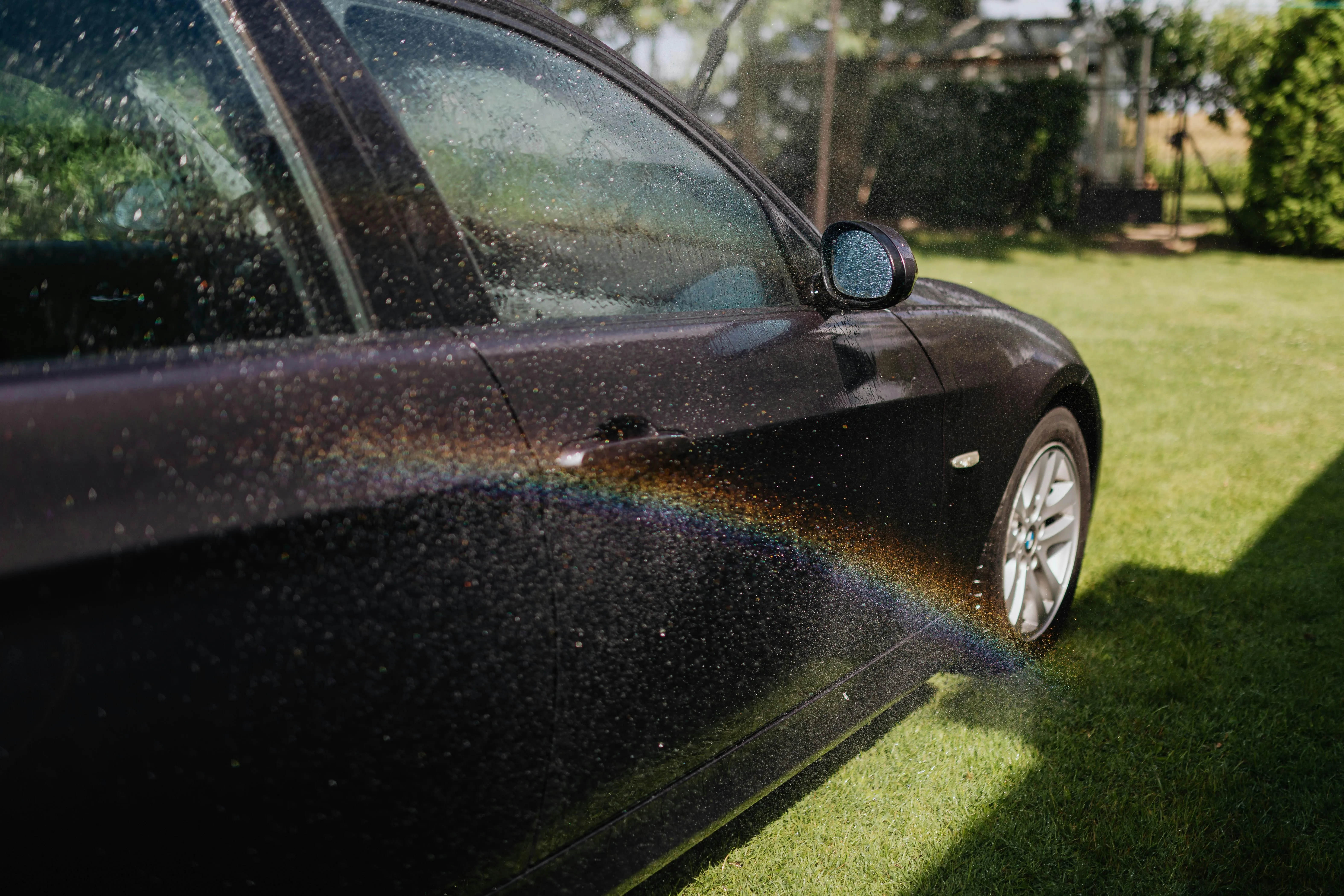 Water Sprayed on Bmw Sedan in a Car Wash Scene Image