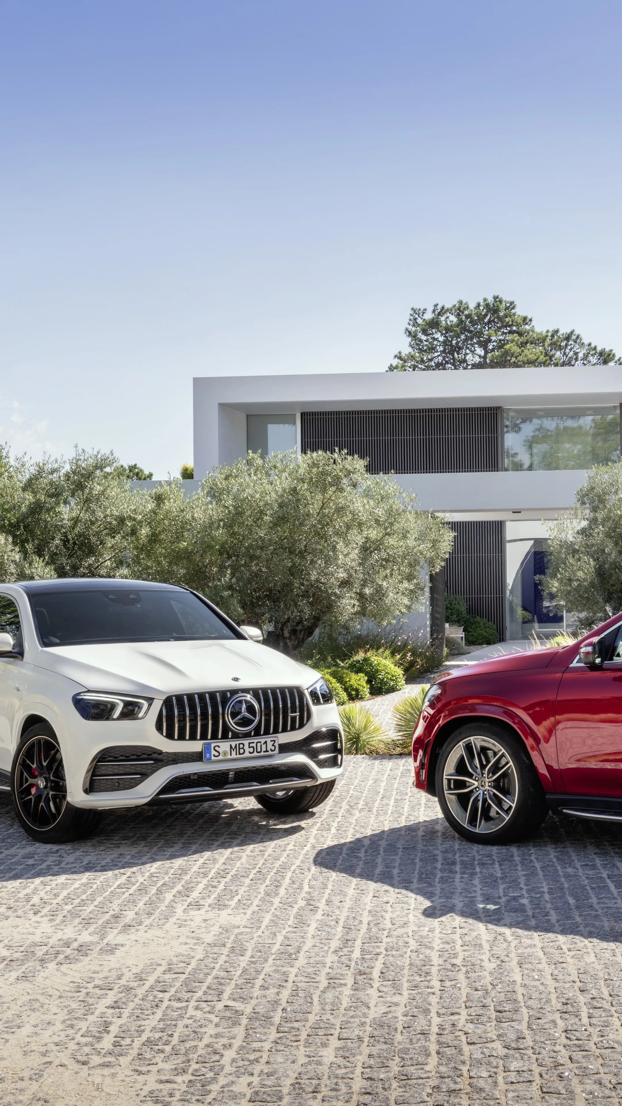 White and Red Mercedes Benz SUVs Parked Outdoors Wallpaper