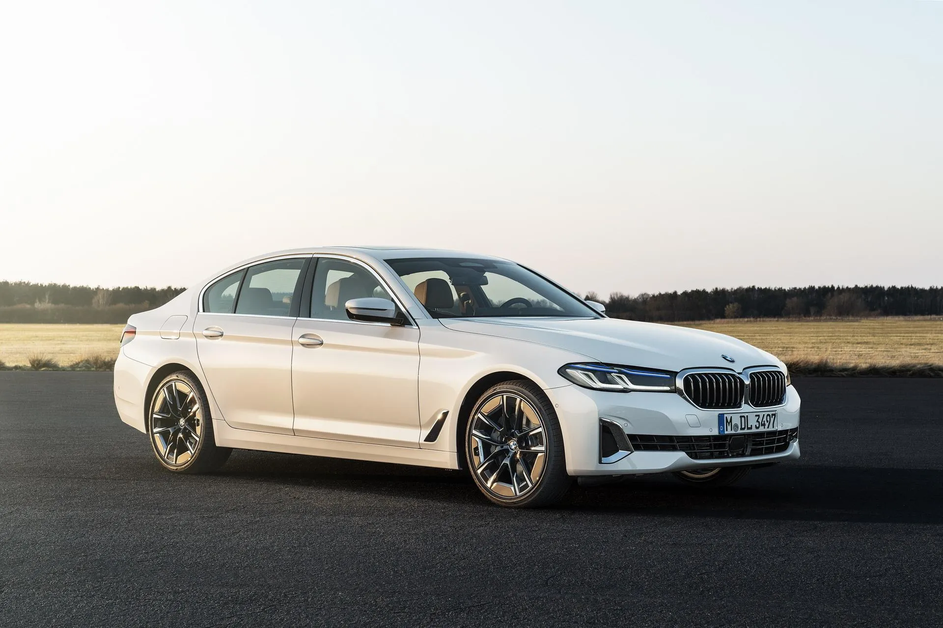 White Bmw 3 Series Driving on Open Field Asphalt Road