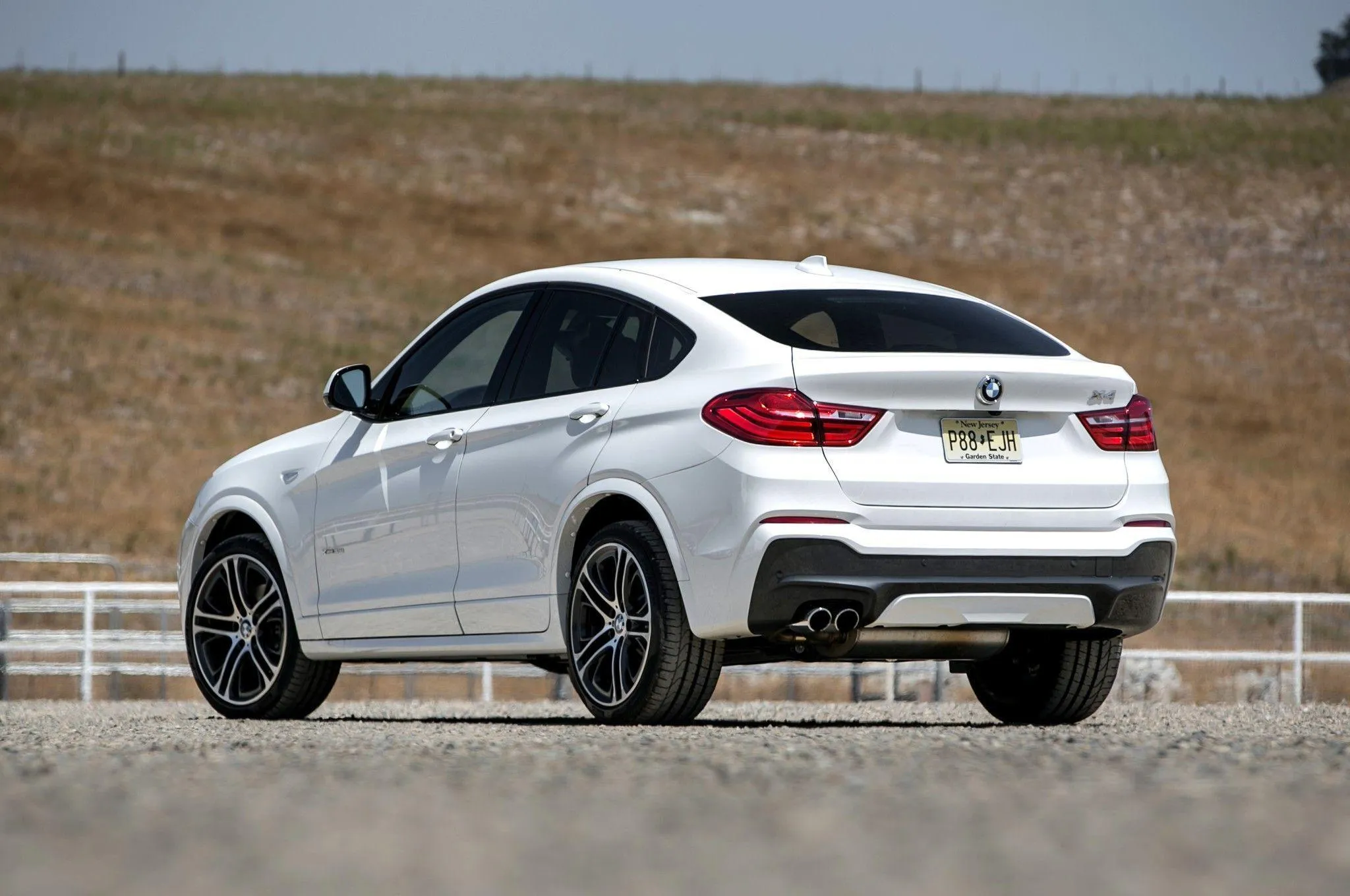 White Bmw Coupe Driving on a Countryside Road