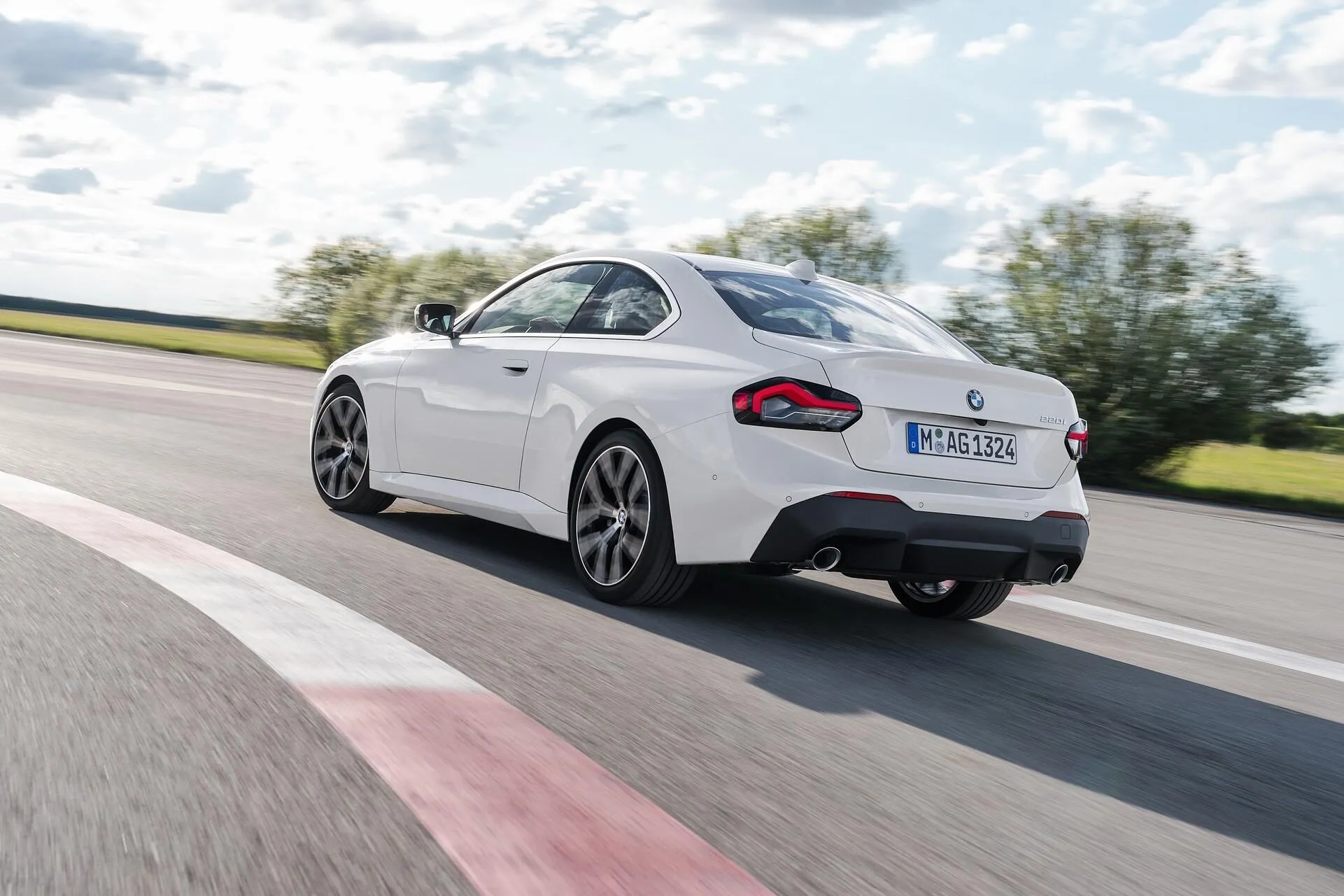 White Bmw Coupe Taking a Turn on Racetrack Wallpaper Hd