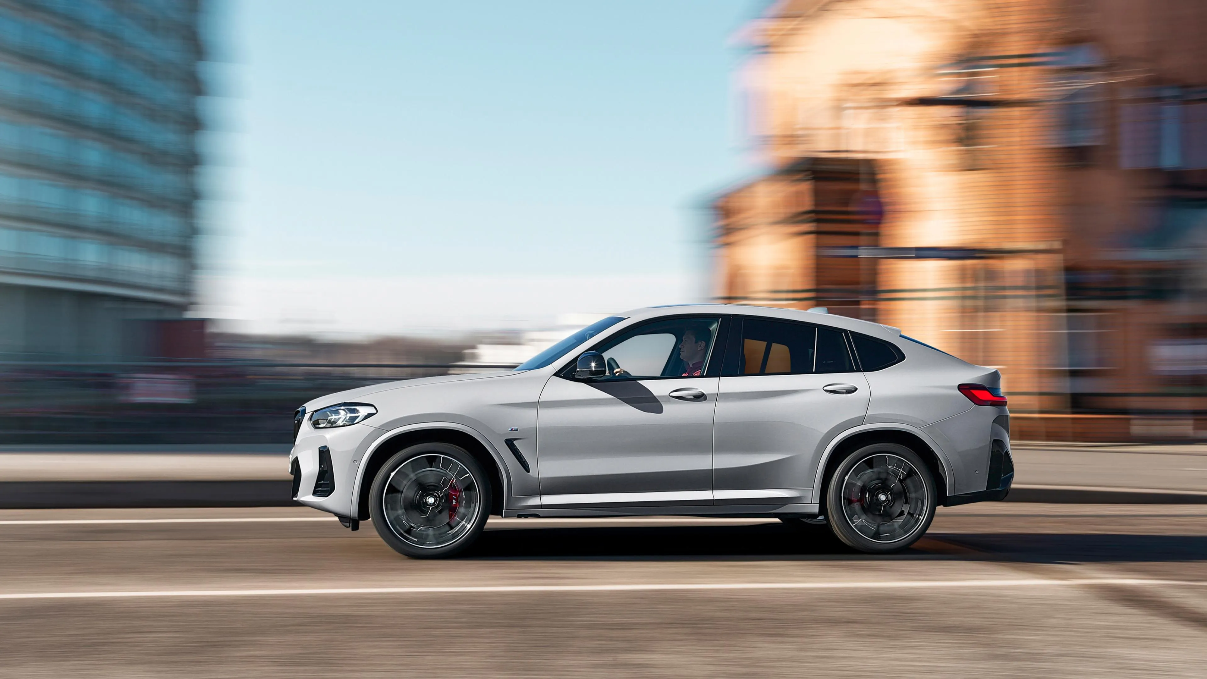 White Bmw Driving Fast Near Modern City Buildings Hd Image