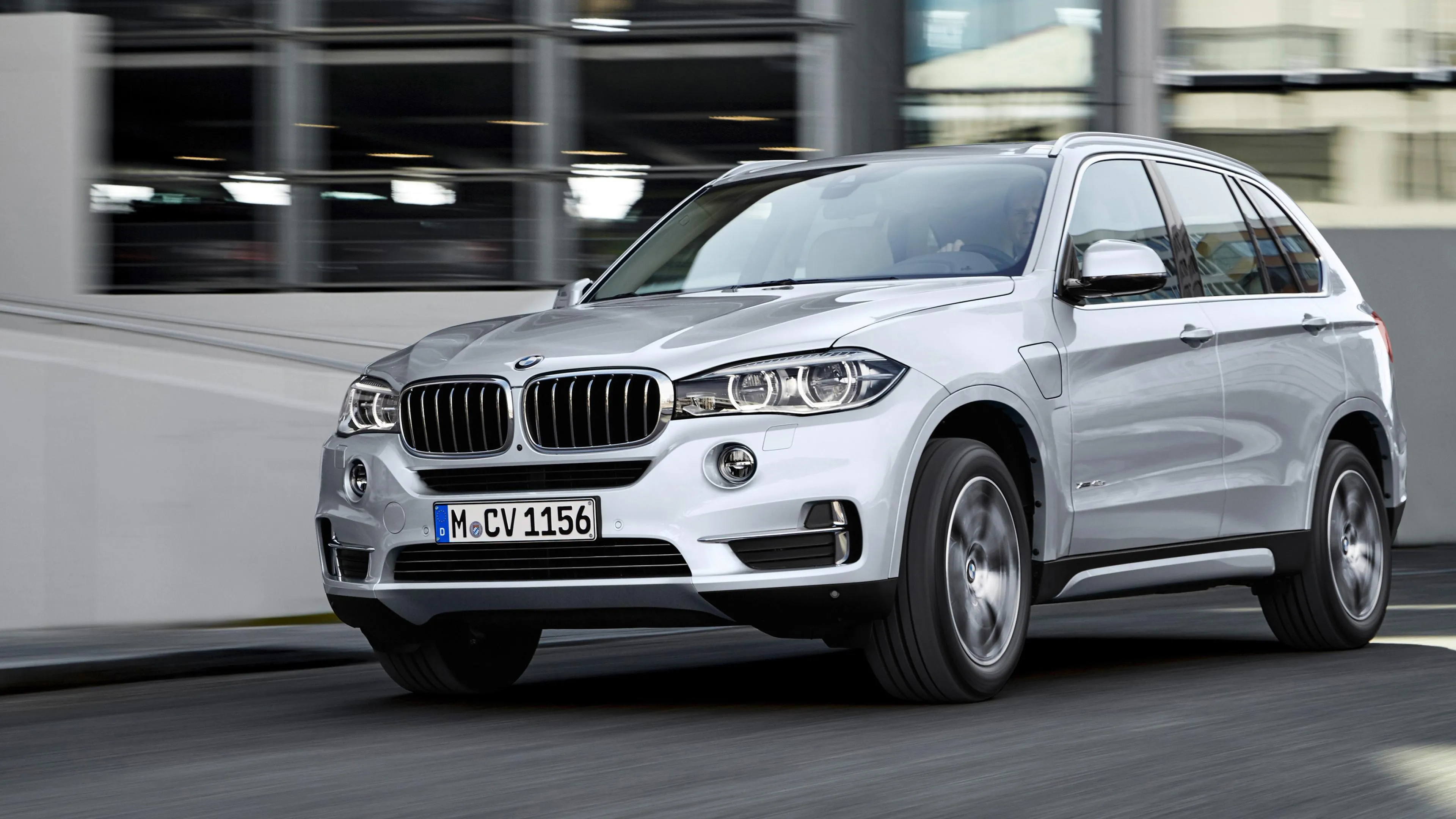 White Bmw Driving Through Parking Garage Fast Wallpaper