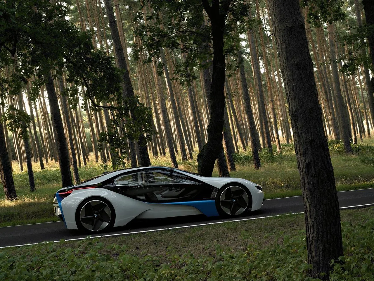 White Bmw I8 Driving Through Forest with Tall Trees