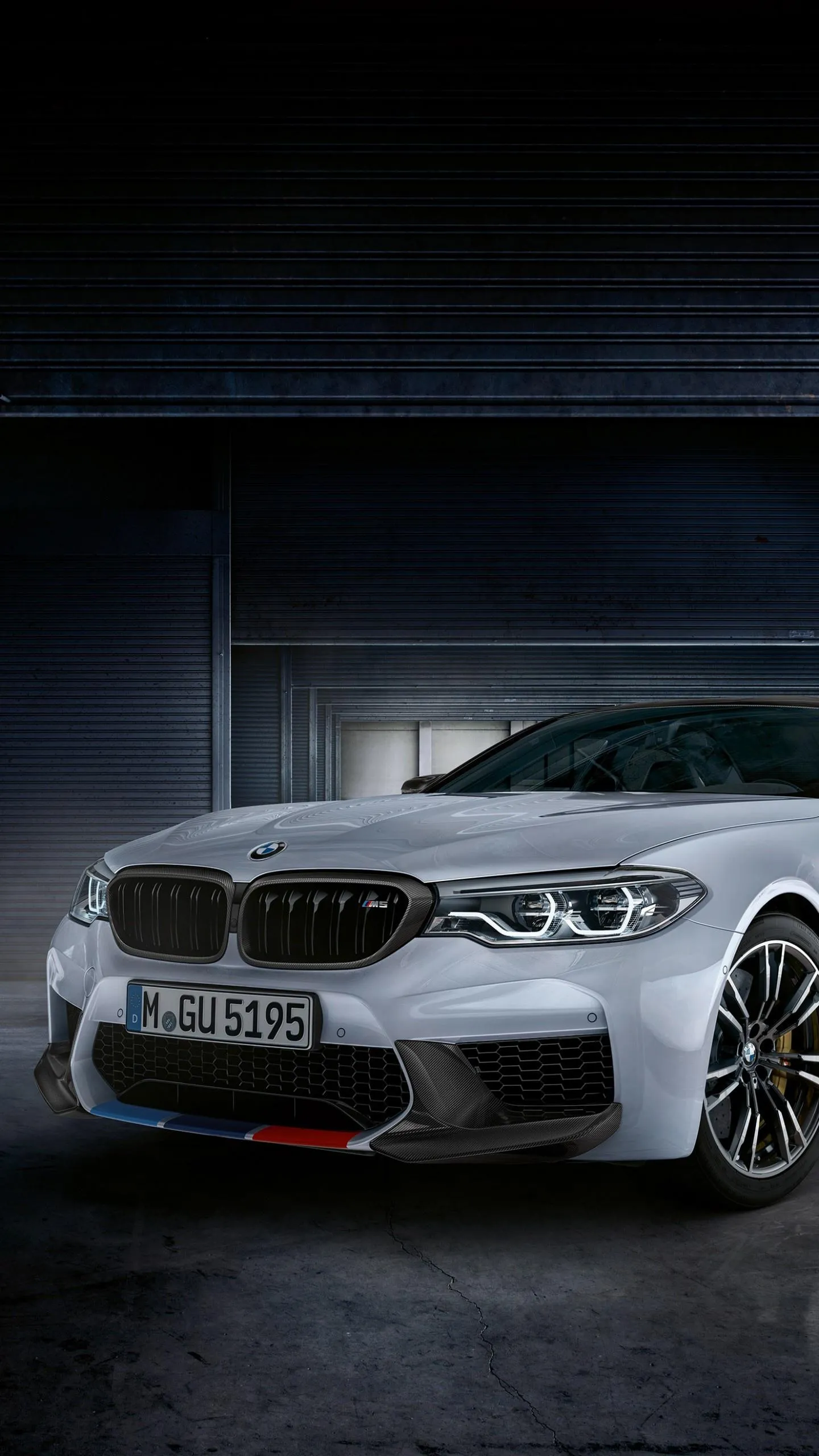 White Bmw in Dark Garage with a Bold Front View Wallpaper