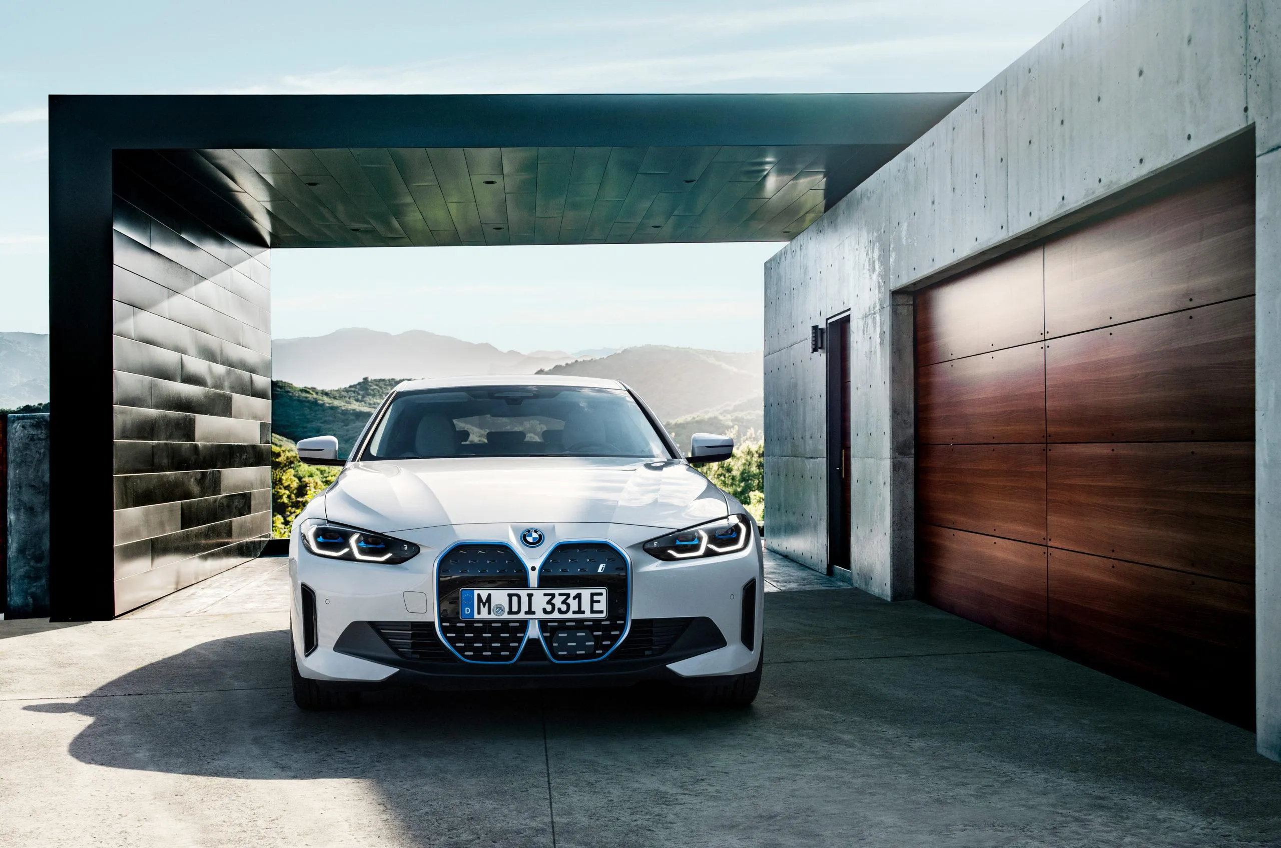 White Bmw in Driveway of a Modern Minimalistic Home
