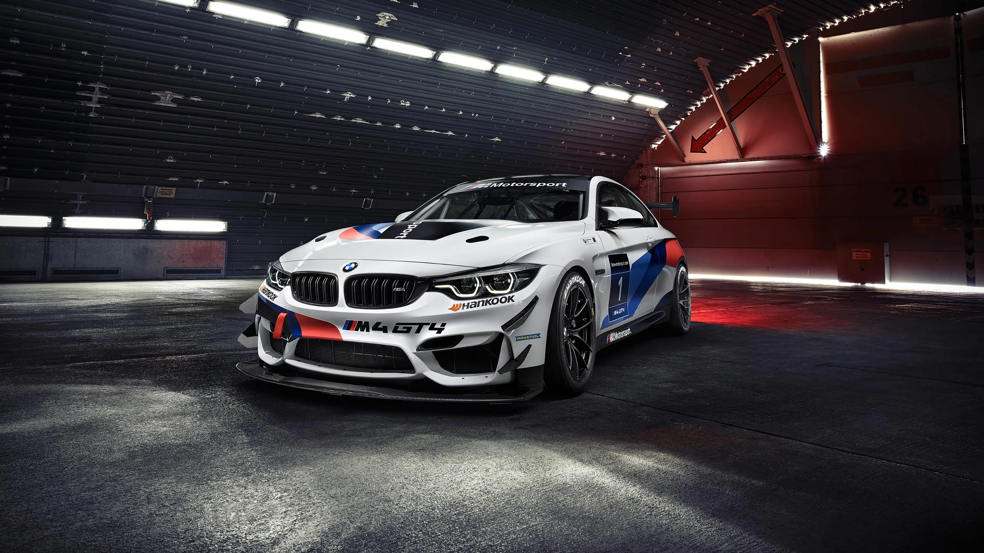 White Bmw in Spotlight Inside Futuristic Showroom Wallpaper