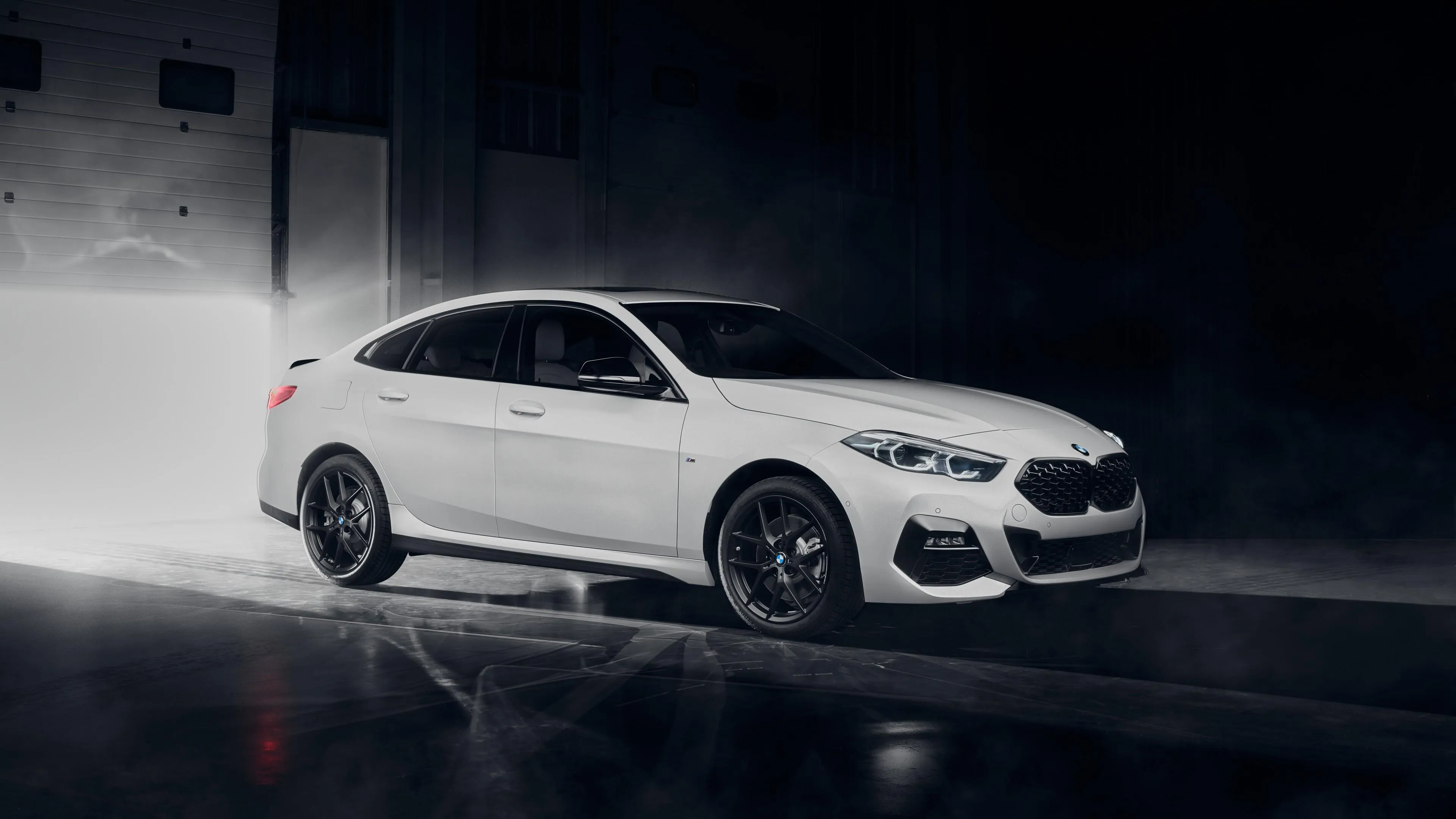 White Bmw Parked in a Tunnel with Glowing Lights Wallpaper
