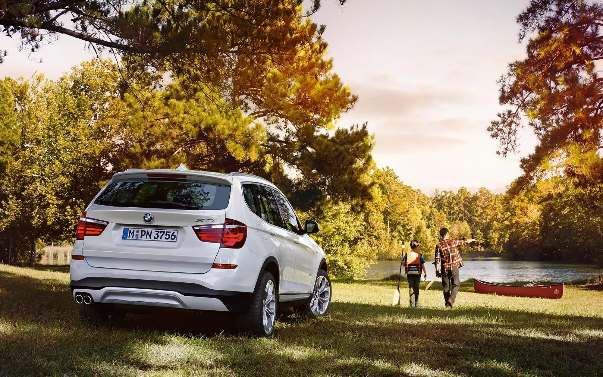 White Bmw Parked Near Park with People Walking Wallpaper