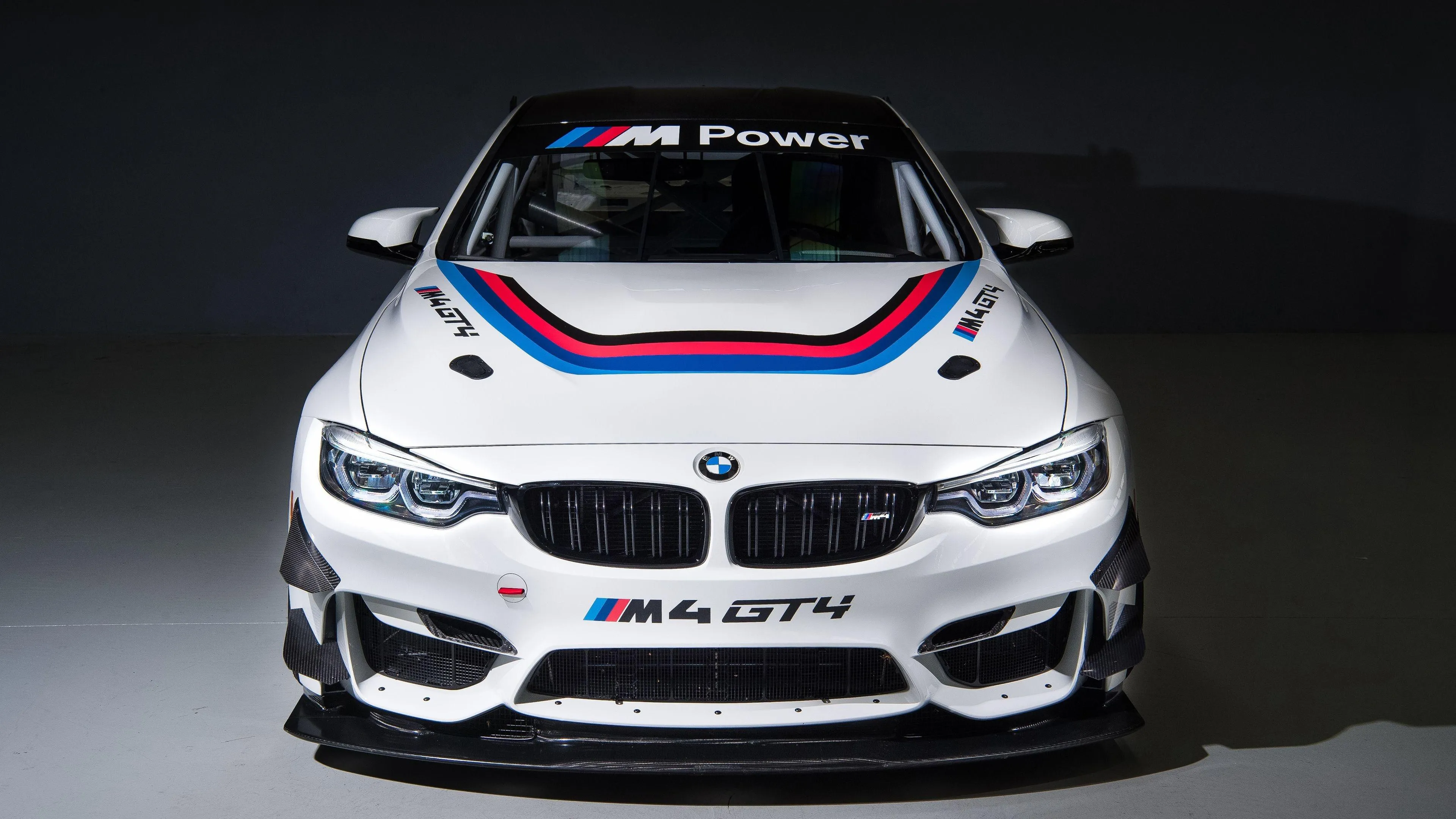 White Bmw Race Car with Performance Decals in Studio