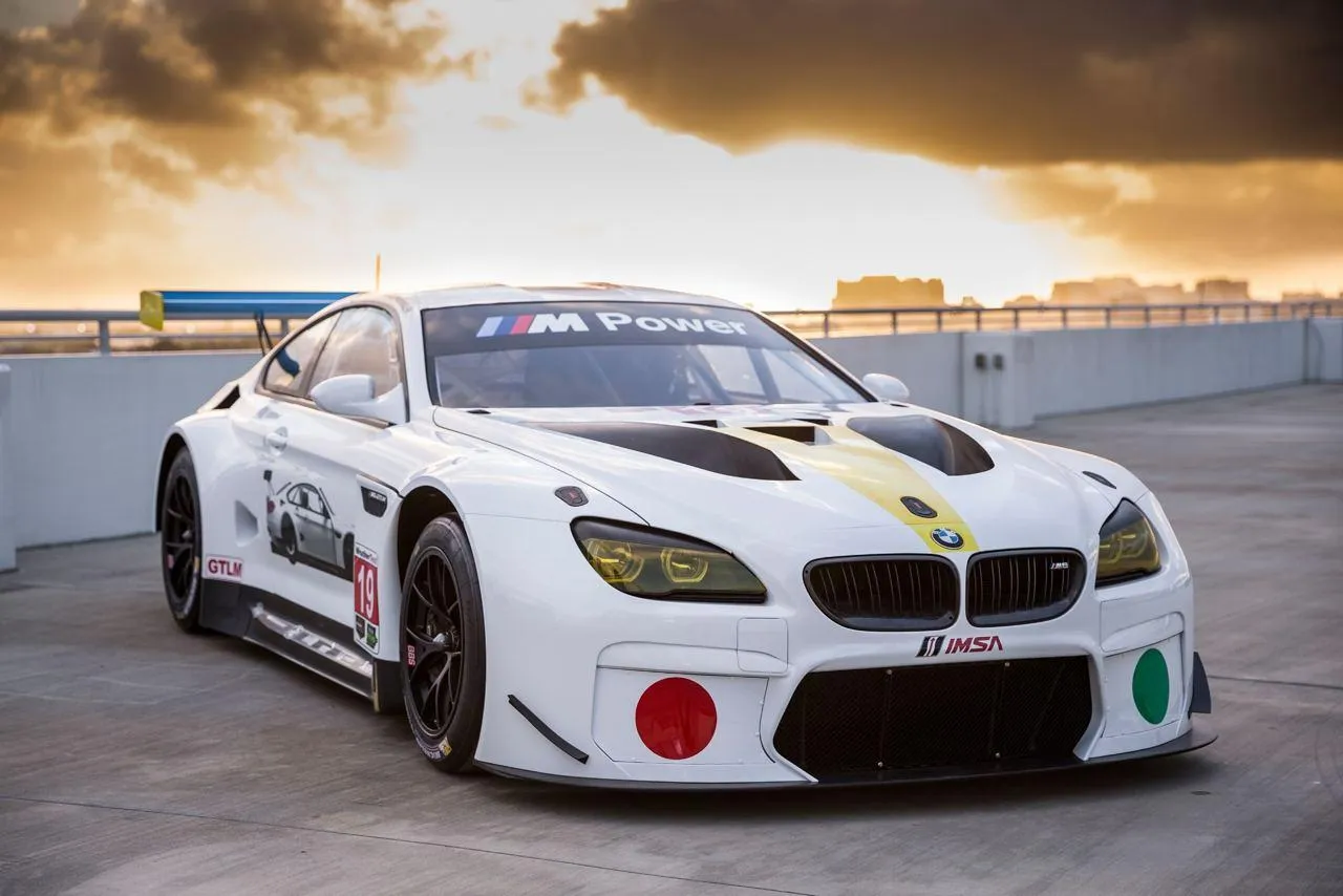 White Bmw Racing Car Parked at Sunset Free Wallpaper