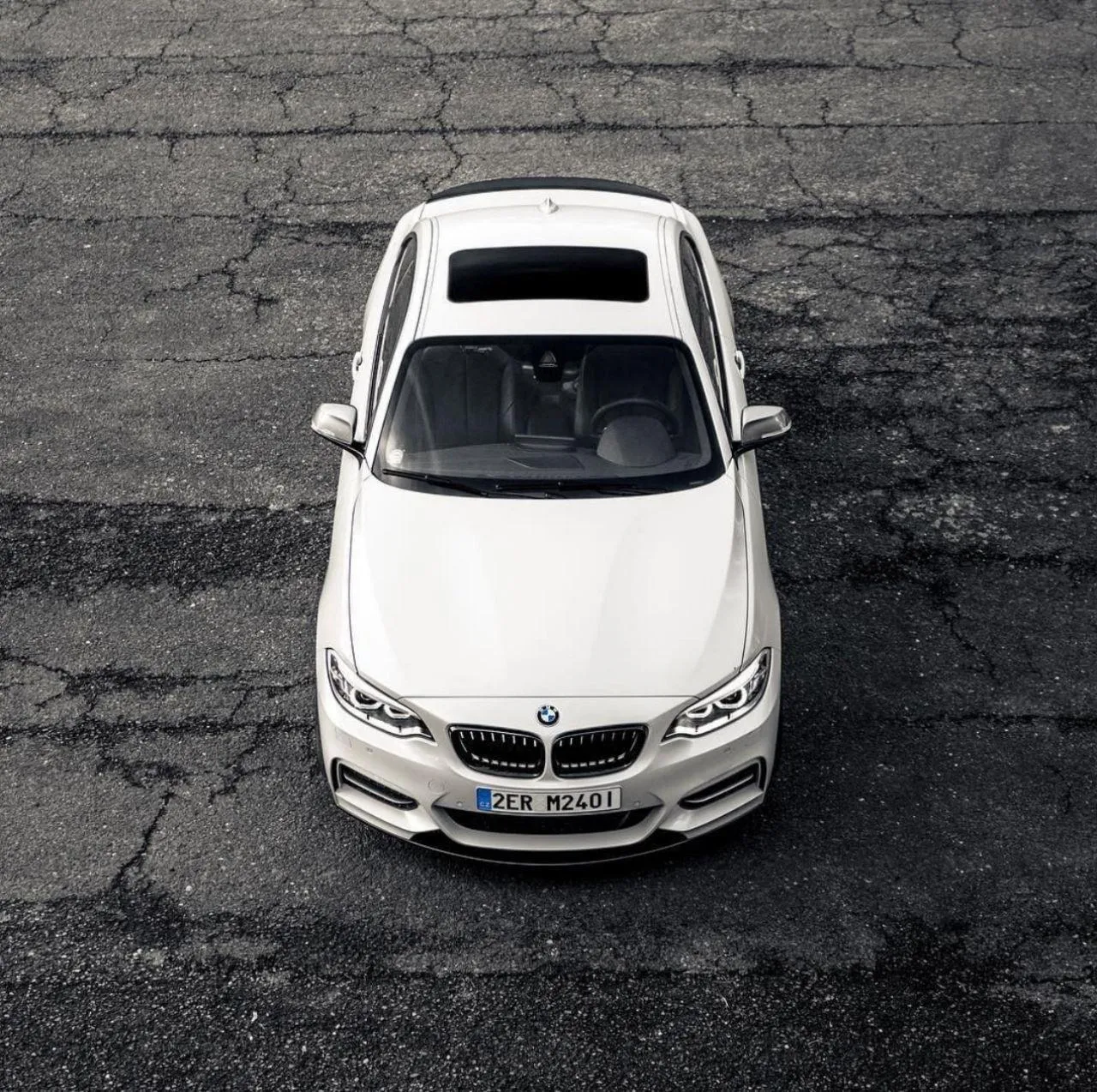 White Bmw Seen From Above on Asphalt Surface Wallpaper