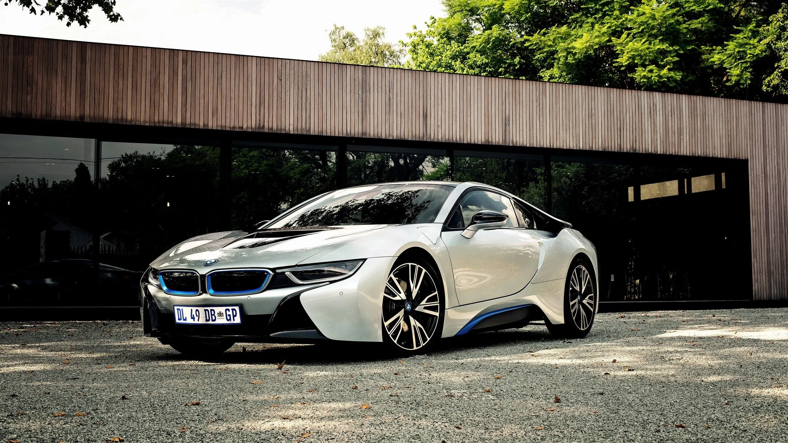 White Bmw Sports Car Parked Near Modern Architecture