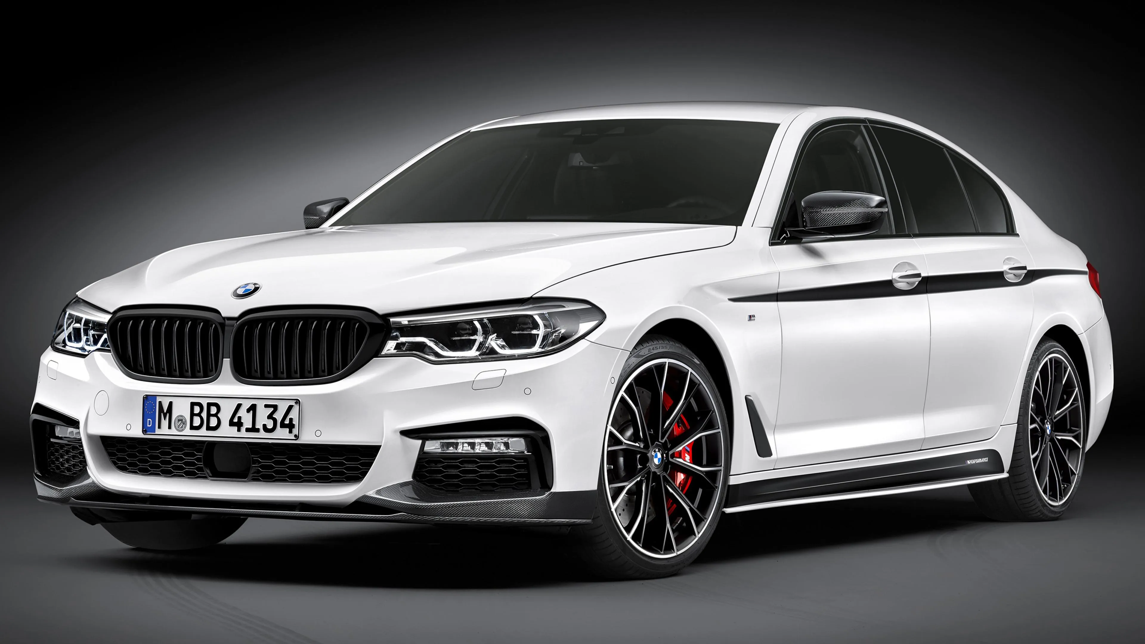 White Bmw Sports Sedan Parked in Professional Studio